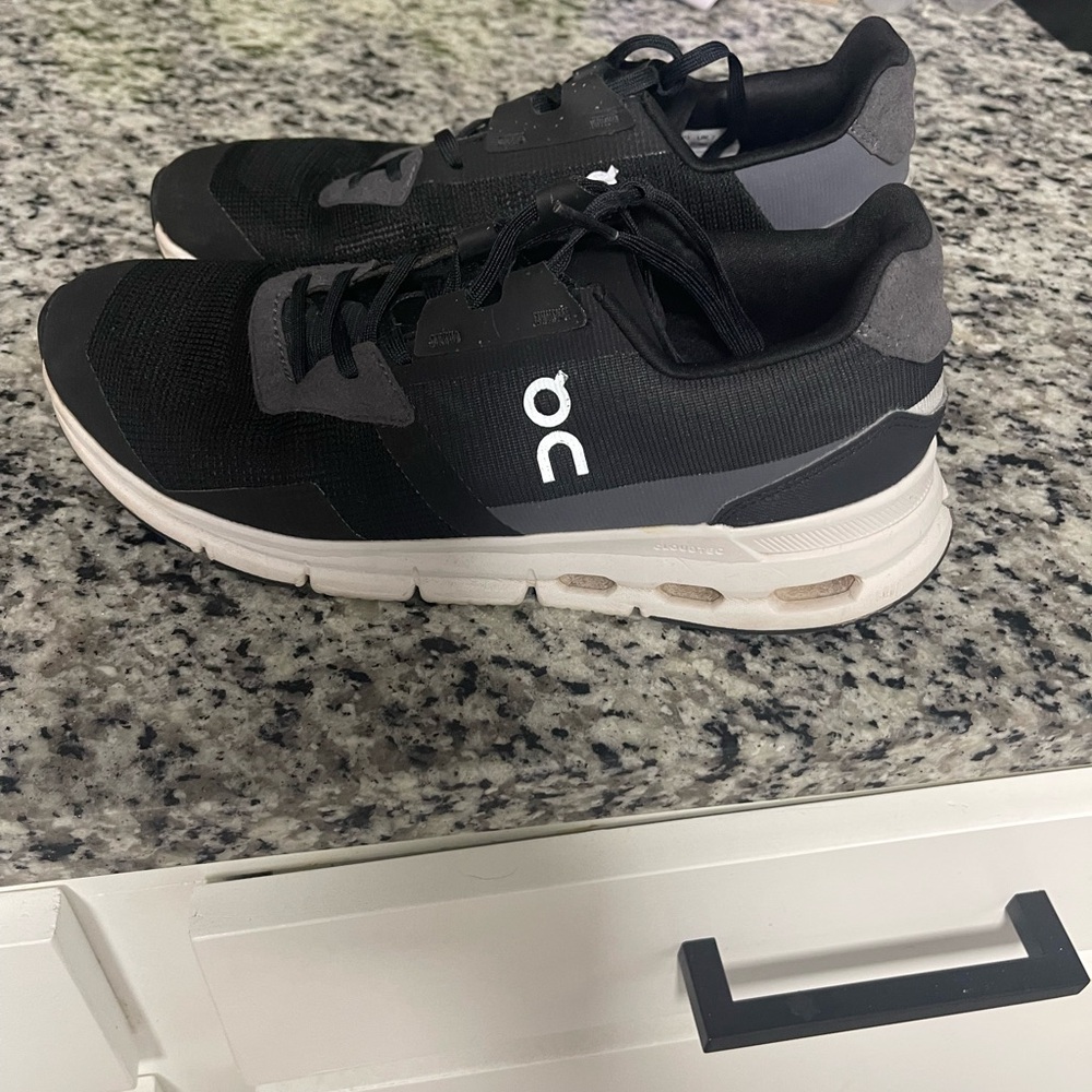 On Running Black and Gray Sneakers with CloudTec Cushioning